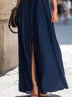 Halter Neck Ruched Knot Front Flowing Maxi Dress