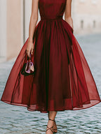 Elegant Sleeveless Halter Midi Dress With Flowing Skirt